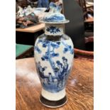 A late 19th/early 20th century Chinese blue and white crackle glaze baluster vase with brown bark