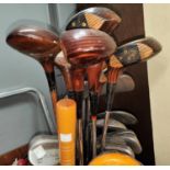 A selection of vintage early 20th century golf clubs:  hickory shat examples; Dai Rees GX woods; bag