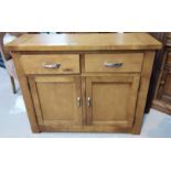 A modern light oak side cabinet with double doors and double drawers above 100 x 34 x ht. 81cm
