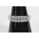 A lady's platinum eternity ring set with 3 rows of diamonds, 7 central row and 2 outer rows of 10,