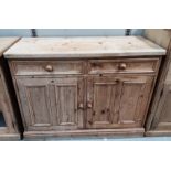 A Victorian style sideboard (stripped pine) with double cupboard and drawers, ht. 91 x 122 x 52cm