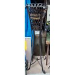 A metal stand with basket interior and a decorate glass top dish table/bird bath