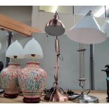 A brushed copper effect angle poise desk lamp, a similar brushed steel and two Chinese lamps