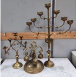 A large brass ecclesiastical candelabrum of 7 branches; a similar smaller 5 branch candelabrum; an