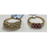 A 9ct gold ring set with 3 oval Thai rubies 0.8cart and white zircons, size L/M, 1.6gms; a 9ct