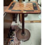 A Victorian inlaid walnut games table with square top, on turned column circular base and pad feet