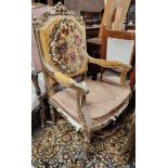 A 19th century Louis XIV style armchair with ornate gilt frame, on turned legs (requires renovation)