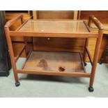 A mid 20th century teak two tier drinks trolley and a corner cupboard