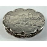 A hallmarked silver vinaigrette of shaped oval form, engraved with a view of Warwick Castle over the