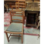 An oak drop leaf dining table with turned legs and a set of 5 oak dining chairs