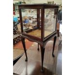 A mahogany framed small square bijouterie cabinet