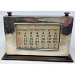 A silver framed desk calendar (a.f.)