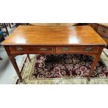 A Sheraton style inlaid mahogany side/library table.