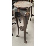 A Victorian mahogany occasional table with octagonal top on central column and triple carved feet;