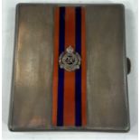 A hallmarked silver cigarette case, engine turned with red and blue enamel decoration and Royal