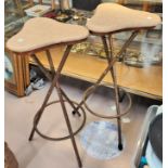 A pair of stools with triangular tops on gilt metal bamboo effect legs; a brass framed stool; an