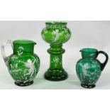 Two Mary Gregory green glass vases and a jug decorated with cherubs; etc.; heights 25, 17 & 15cm