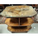 An Art Deco octagonal coffee/occasional table in quarter veneered walnut, with shelves under