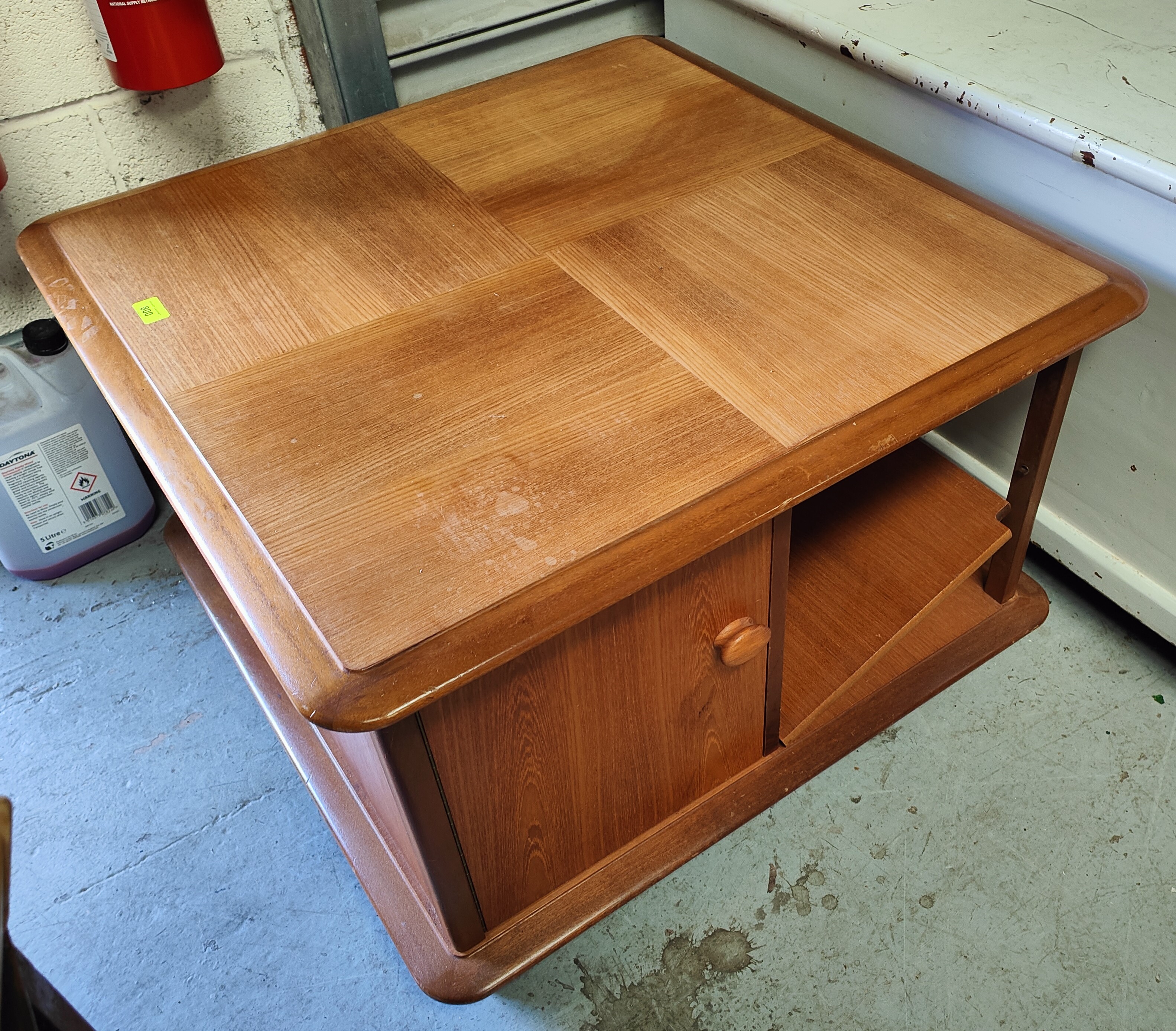 A mid 20th century teak modular coffee table with cupboards/shelves under by Nathan