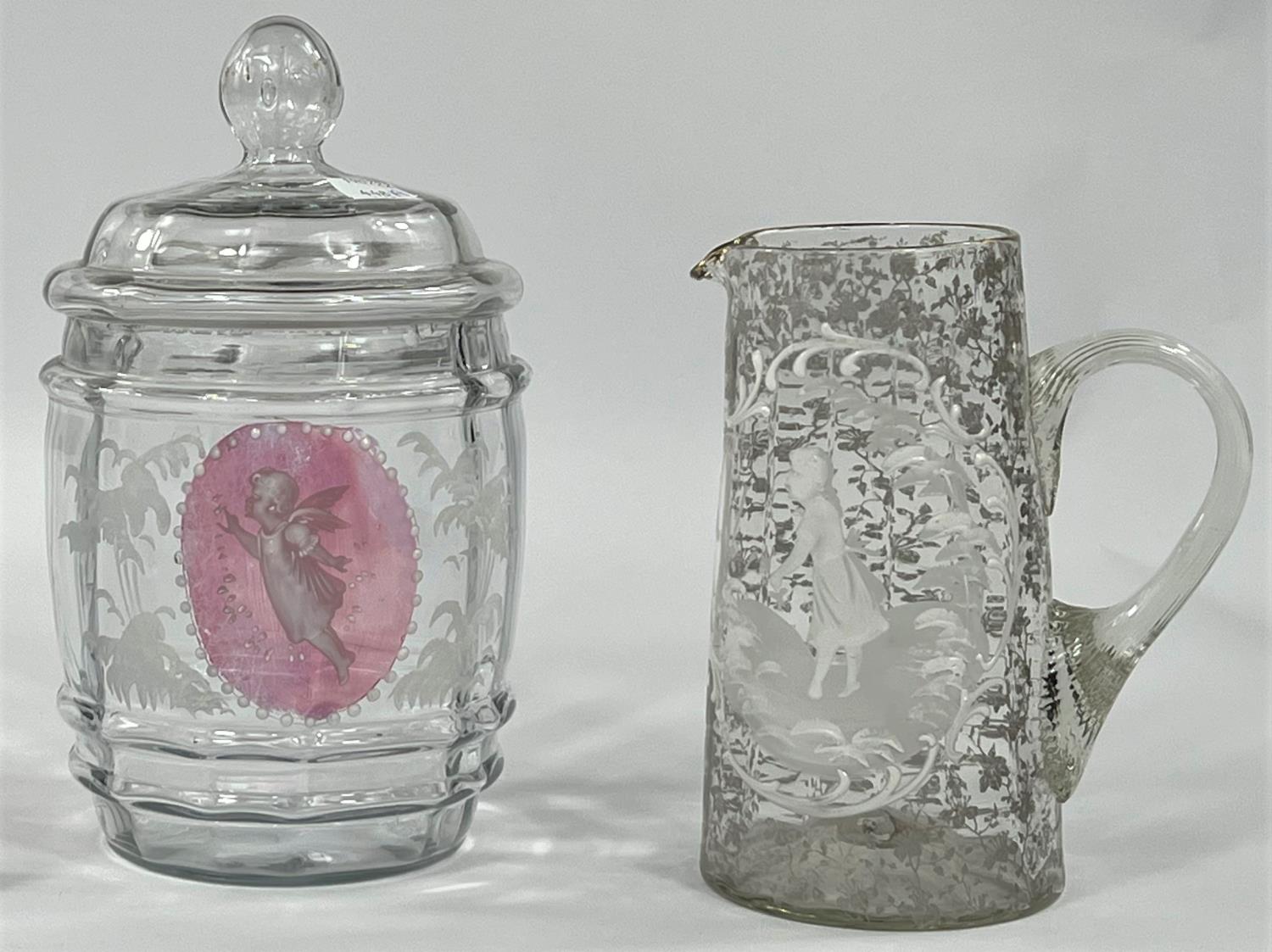 A Mary Gregory biscuit barrel with cranberry reserve panels of cherubs; a pair of matching tumblers; - Image 2 of 2