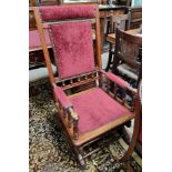 A late 19th century American rocking chair in burgundy