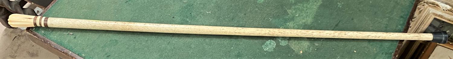 A whalebone walking stick; 4 other sticks