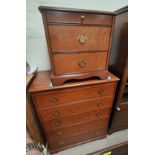 A Stag chest of 5 drawers; a pair of similar bedside cabinets; a mirror