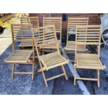 Six folding teak garden chairs