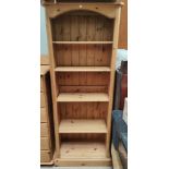 A Victorian stripped pine wardrobe with single door
