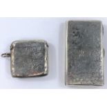 A hallmarked silver rectangular chased cigarette case, Chester 1898; a similar vesta case,