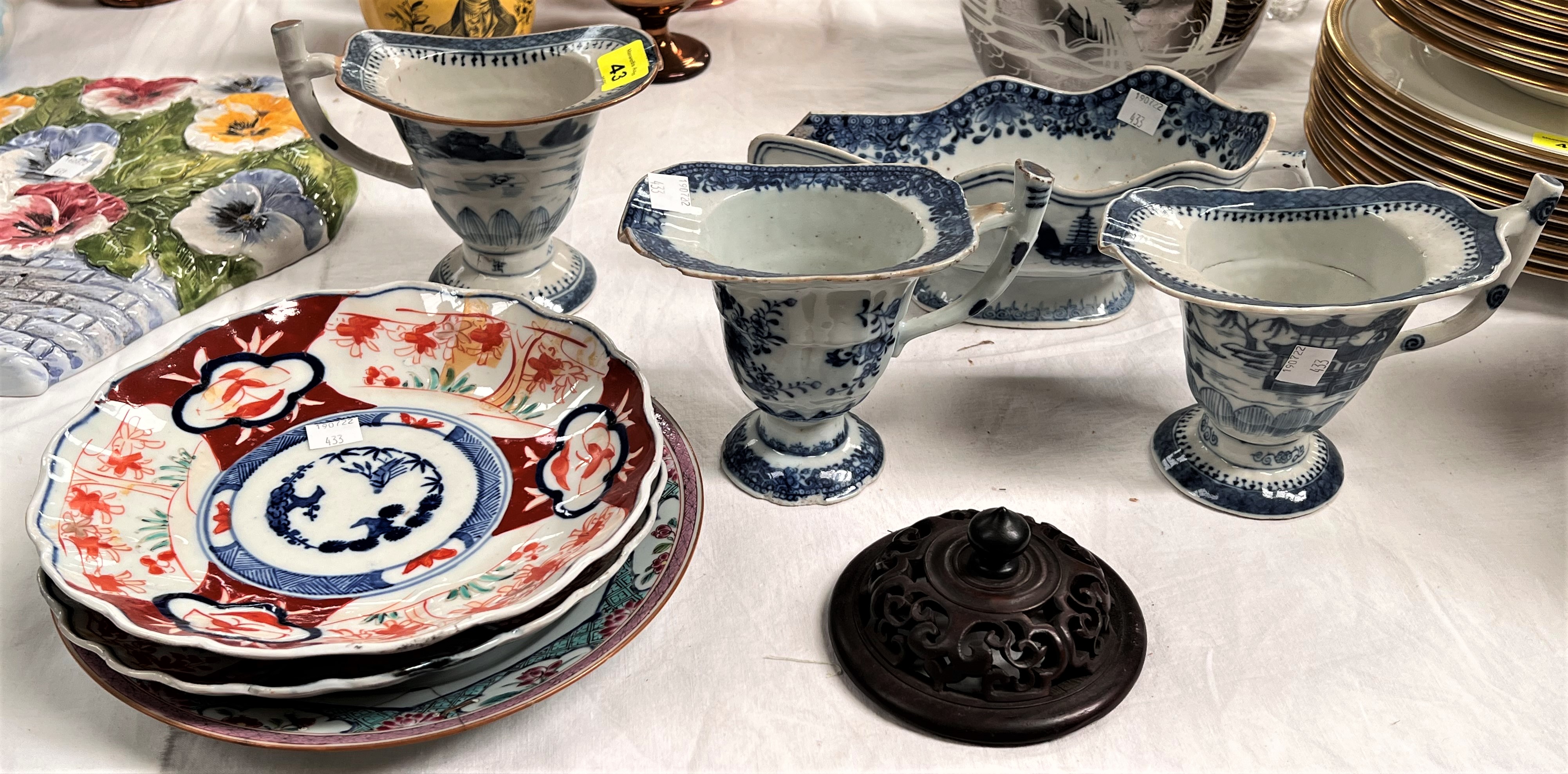 A 19th century Chinese pair of blue & white jugs decorated with pagodas, height 13cm; a similar