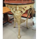 A gilt framed, cast iron, Britannia pub table.