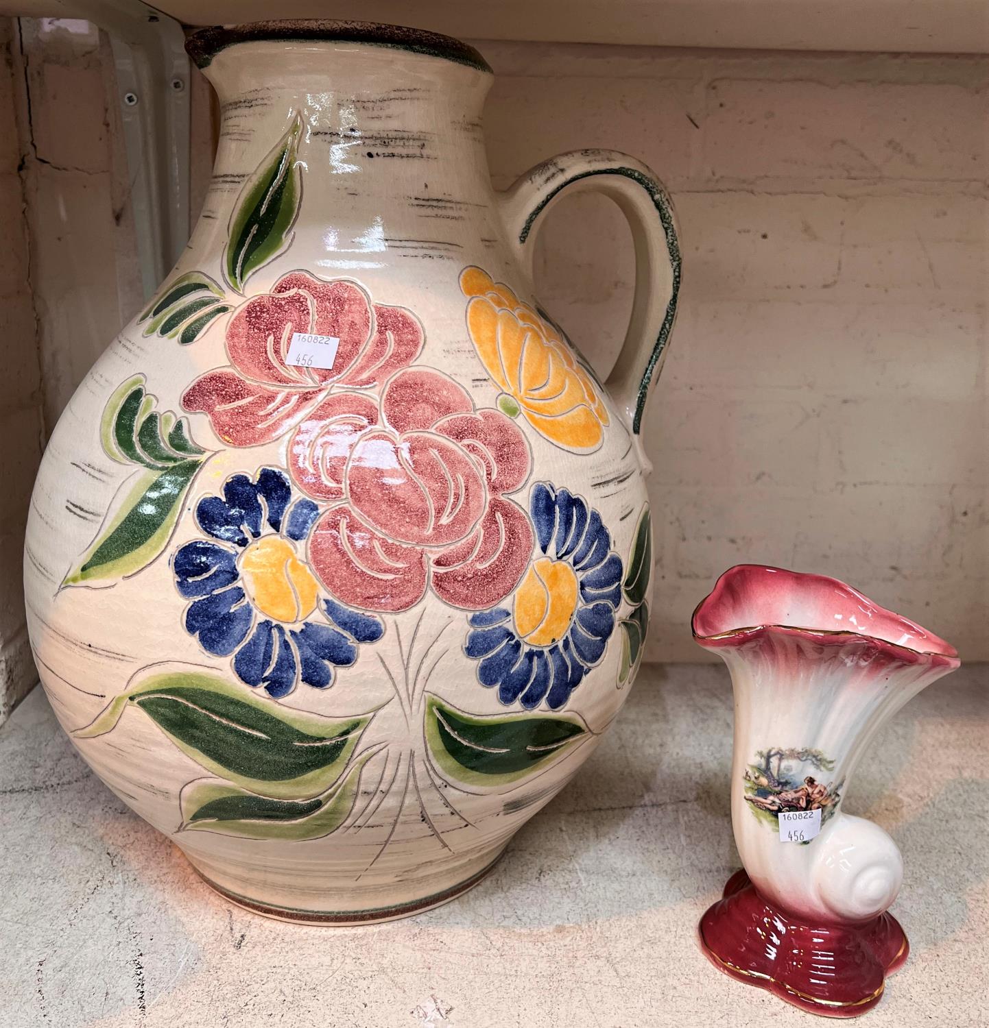 A Victorian red and white toilet set; large jugs; etc.