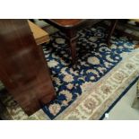 A modern blue ground Persian carpet with multiple border and all over flower head & leaf decoration,