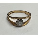 An 18 carat hallmarked gold split shank ring with illusion set solitaire, 3.0 gm, size 'N', diameter