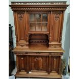A late 19th century walnut French provincial full height side cabinet with turned gallery, central