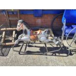 A vintage metal rocking horse