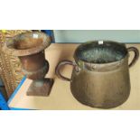 A small cast iron urn shaped planter and an unusual copper double handled vase/planter in Arts and