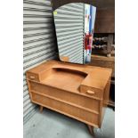 A mid 20th century light oak dressing chest with two small and two long drawers