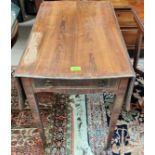 A crossbanded walnut Pembroke table in the Regency style with shaped leaves and frieze drawer, on