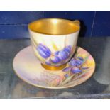 A Royal Worcester miniature cup and saucer, hand painted with iris, etc., gilt highlights, signed
