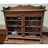 An early 20th century oak table top display cabinet enclosed by 2 glazed doors, length 78cm