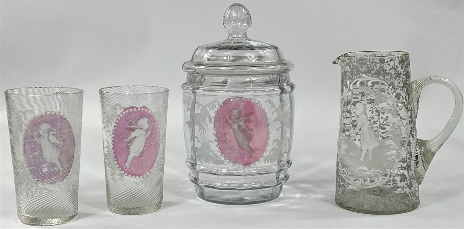 A Mary Gregory biscuit barrel with cranberry reserve panels of cherubs; a pair of matching tumblers;