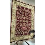 Two maroon & cream traditional patterned rugs (1 slightly a.f.)
