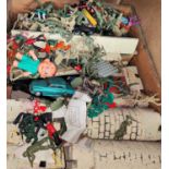A vintage toy castle with large selection of vintage plastic soldiers etc
