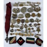 A selection of military badges etc