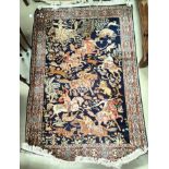 A 20th century "Indo Persian Silk" rug, hand knotted decorated with hunters on horseback chasing