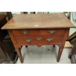 An 18th/19th century country made lowboy, 1 long and 2 short drawers with brass drop handles and