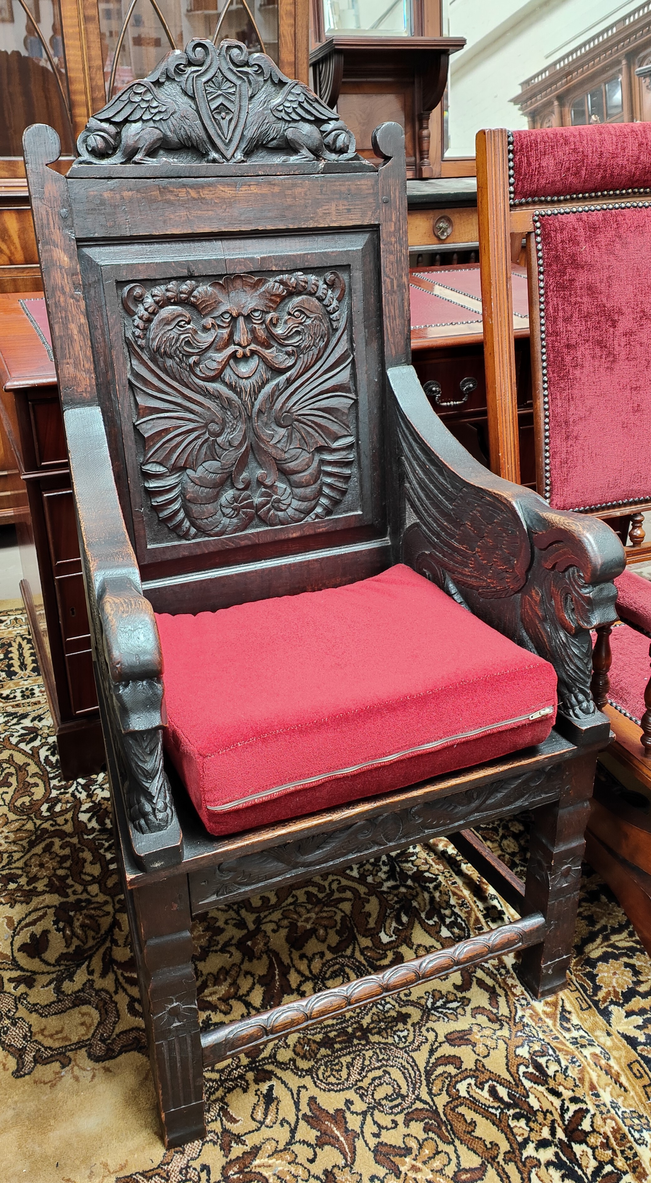 A Victorian and earlier oak 'Wainscot' chair with extensive carved decoration