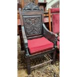 A Victorian and earlier oak 'Wainscot' chair with extensive carved decoration